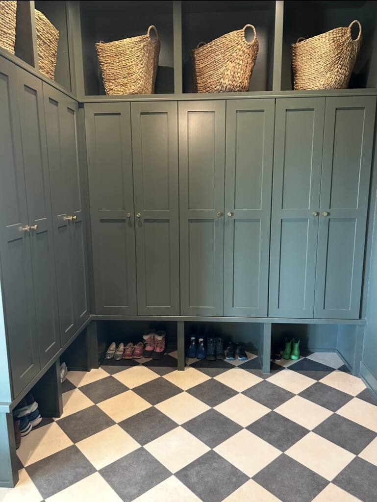 an organized mudroom or drop zone for kids and adults